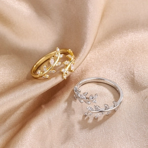 Elegant adjustable leaf ring with cubic zirconia in gold and silver finishes