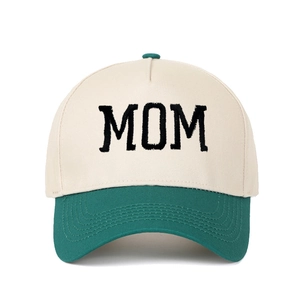 Close-up of MOM embroidery and premium stitching on two-tone canvas trucker hat