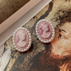 Vintage style cameo earrings with pink portrait and pearl border on gold base