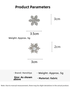 Detailed view of silver snowflake hair clips with rhinestones and pearl accents