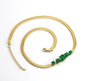 Detail of 18k gold plated flat snake chain with five square green zircon stones
