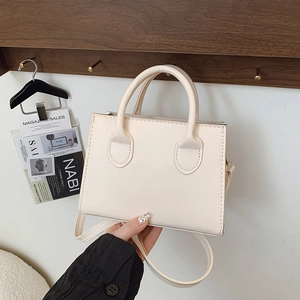 Minimalist beige PU leather square crossbody handbag with top handles and shoulder strap