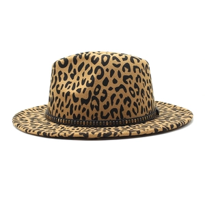 Close-up of leopard print fedora hat featuring a black band with bronze metal rivets