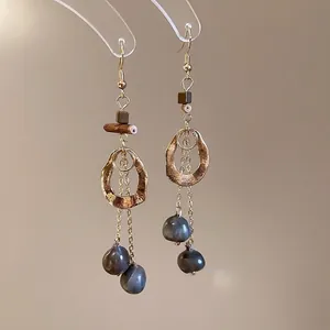 Ethnic wood geometric circle earrings with long tassels and blue teardrop beads