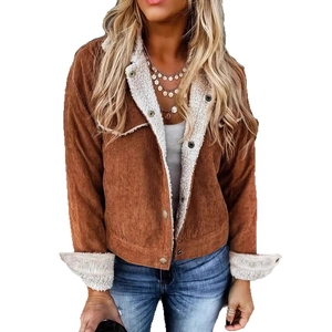 Detail view of brown corduroy jacket featuring white faux sherpa lining and metal buttons
