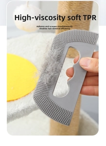 Macro shot of flexible TPR pet hair remover tool covered in cat fur for cleaning