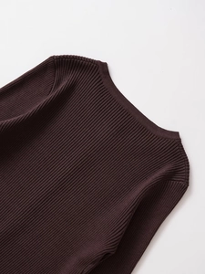 Close-up of dark brown ribbed knit sweater showing neck and shoulder fabric texture