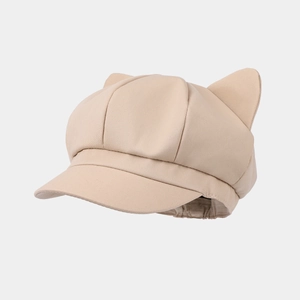 Detail of beige newsboy hat featuring cute cat ear design and adjustable elastic back band