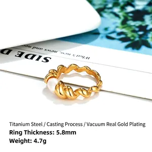 14k gold-plated twisted titanium steel ring with a natural freshwater pearl