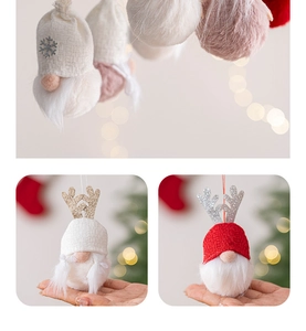 Detail of plush Christmas gnome ornaments with glittery antlers and soft knitted textures
