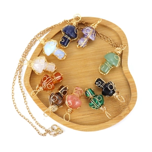 Handmade gold wire-wrapped mushroom pendant necklaces with natural gemstones and crystals