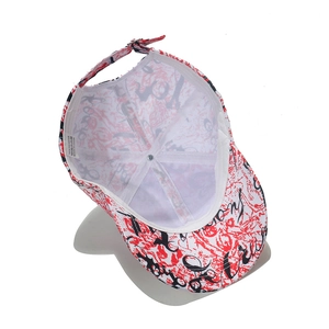 Close-up of baseball cap interior with abstract graffiti print and 100% polyester wash label