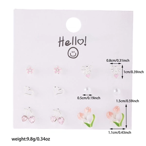 Detail view of 6-pair earring set featuring cherry, tulip, and heart designs in pink silver