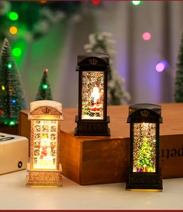 Detailed view of LED Christmas telephone booth lanterns with Santa and snowman scenes