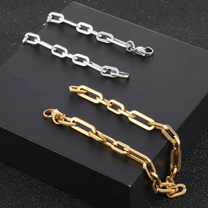 Macro shot of stainless steel chain bracelets with lobster clasp in gold and silver