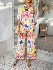 Close-up of bohemian colorful geometric abstract print on women's two-piece set fabric