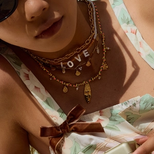 Bohemian gold layered necklace set with shell pendants and colorful braided rope