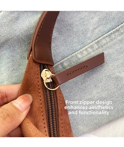 Detail of front metal zipper and stitching on brown suede large capacity tote bag