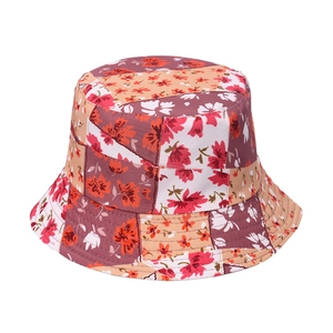 Detail shot of multi-color floral patchwork pattern on cotton wide brim sun bucket hat