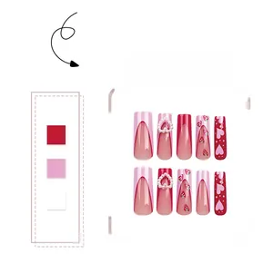 Detail of pink and red press-on nails with 3D pearl hearts and strawberry art