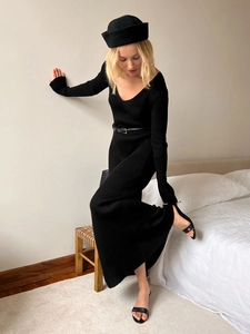 Elegant black V-neck ribbed knit midi dress with long sleeves and a matching waist belt