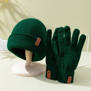 Deep green knitted beanie and gloves set with leather fashion patches for winter warmth