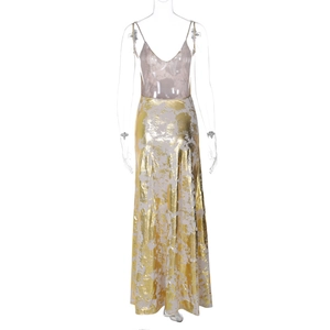 Detail view of the metallic bronze fabric and fine straps on this V-neck summer maxi dress