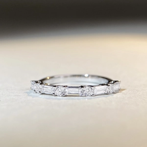 Detailed view of S925 silver eternity ring with rectangular and round cubic zirconia