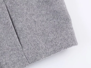 Close-up macro of premium grey wool fabric texture with thick felted fiber details