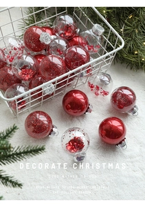 Detail of red glitter and sequined Christmas balls in a white basket with pine needles