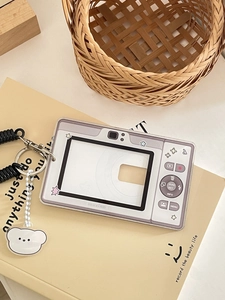 Macro shot of retro camera acrylic card holder with spiral lanyard and bear charm