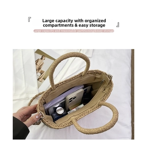 Top view detail of straw woven tote bag showing large capacity and internal zipper pocket