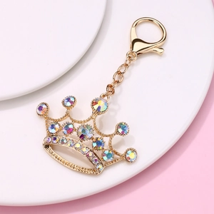 Close-up of golden crown keychain with colorful AB rhinestones and secure metal clasp