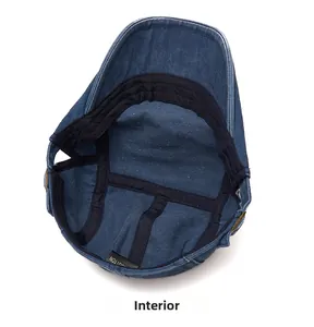 Internal view showing denim flat cap lining with cotton sweatband and copper buckle