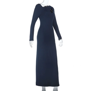 Detail of navy blue long sleeve dress with asymmetric cutout neckline and slim fit