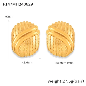 Detailed view of layered geometric oval earrings in gold titanium steel with dimensions