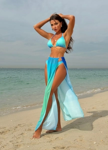 Detailed beach view of a gradient blue 3-piece bikini set with metallic chain waist decor