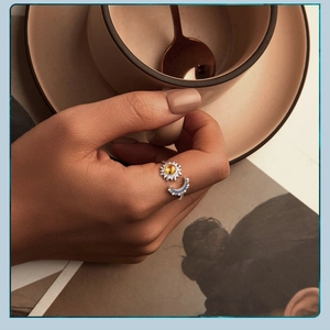 Close-up of woman wearing s925 silver sunflower and crescent moon adjustable open ring