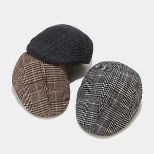 Three classic autumn winter wool plaid ivy caps in brown and grey stylish patterns
