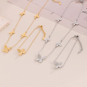 Chic butterfly necklace and bracelet set in gold and silver stainless steel finishes