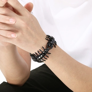 Close-up of black stainless steel centipede bracelet in a gothic punk design for men