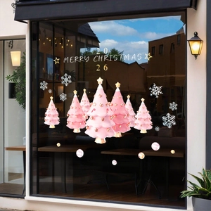 Pink Christmas tree window decals with white snowflakes and golden Merry Christmas text