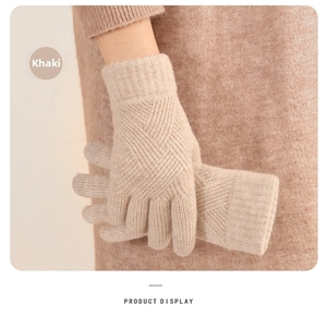 Detail of khaki cable knit gloves showing soft wool texture and elastic ribbed cuffs