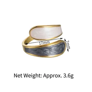 Detail shot of double-layer gold open ring with marble enamel and size measurements