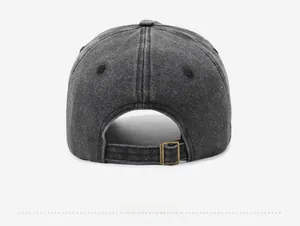 Detailed back view of washed denim baseball cap with vintage metal buckle adjustment