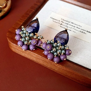 Vintage teardrop earrings with dark blue zircon and beaded accents in retro style