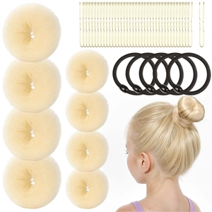 Hair styling tool kit with beige sponge bun makers, gold hairpins, and black elastic bands