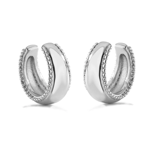 Close-up of polished C-shaped ear cuffs with milgrain bead edges in shiny silver finish