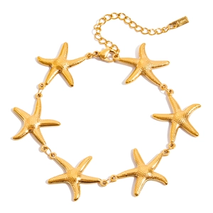 Golden starfish freshwater pearl bracelet made of durable stainless steel on white background
