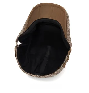 Internal view of the brown newsboy cap showing soft black fleece lining for warmth